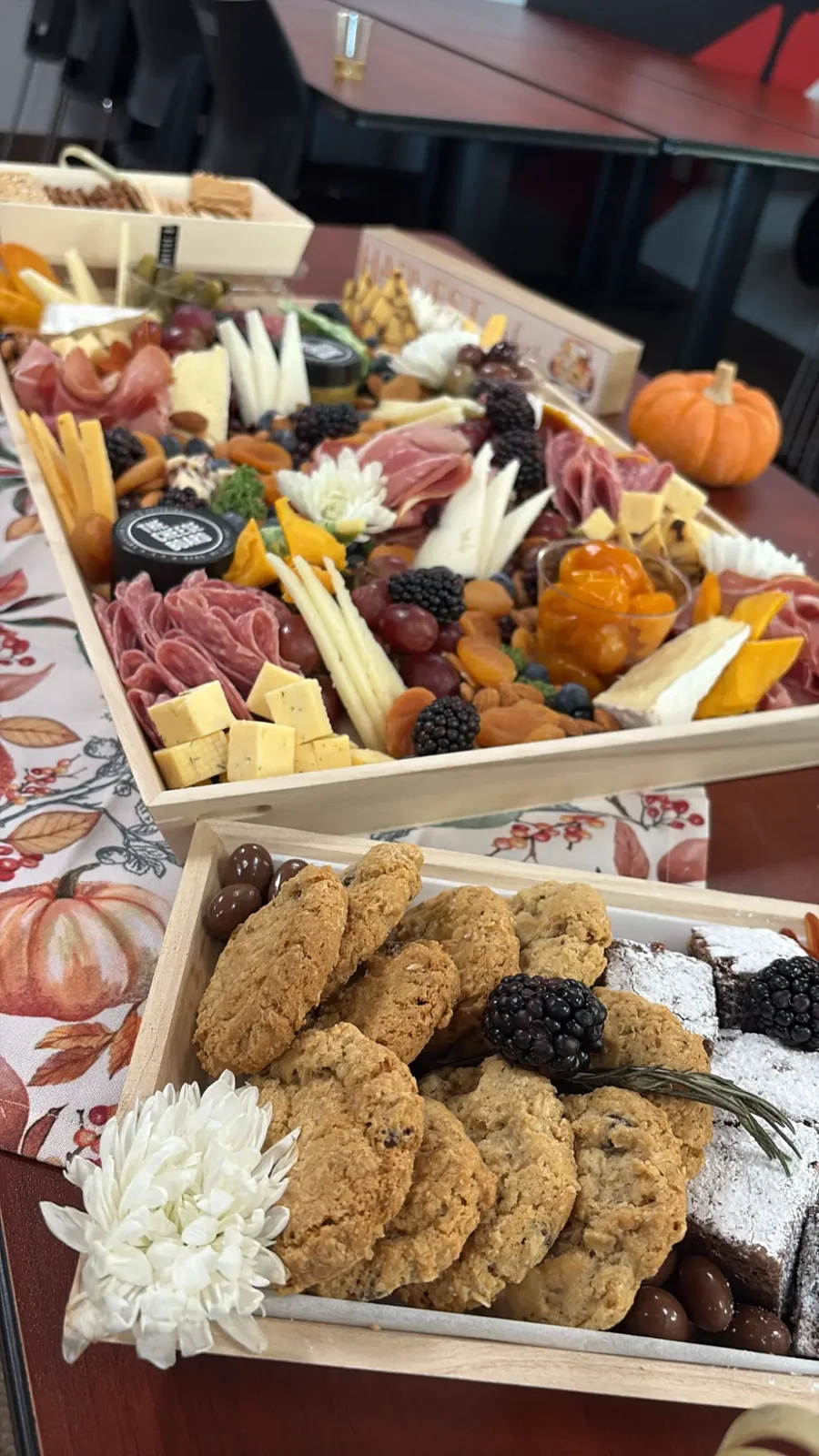 Charcuterie and dessert trays on a table